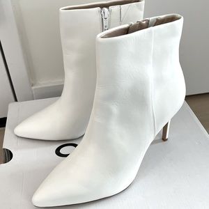 Stylish ALDO ankle boots, preowned, clean white faux leather.